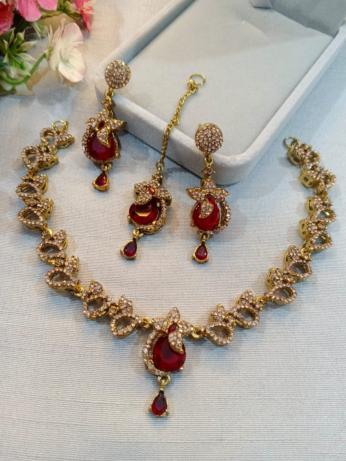 Brown polish zircon necklace set with earrings and tikka, ruby red stones