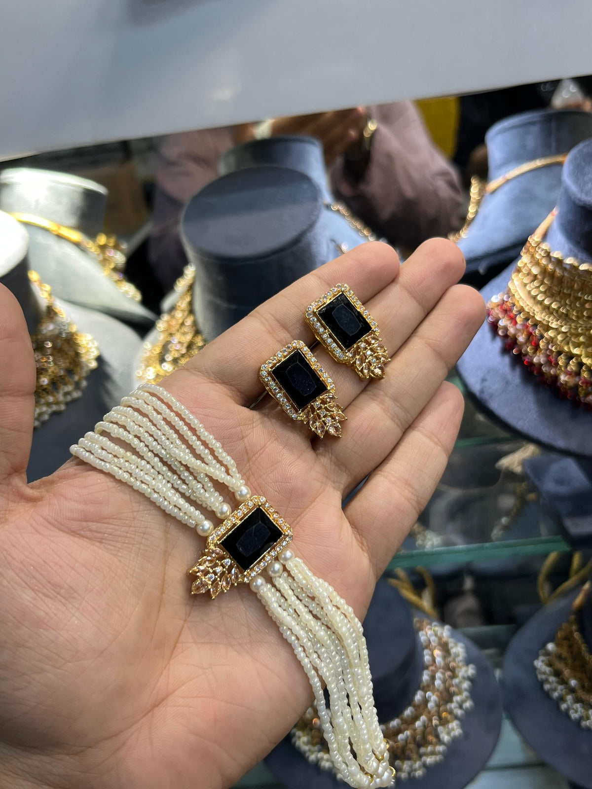 Gold polish zarqoon pearl choker set with earrings, jet black stone