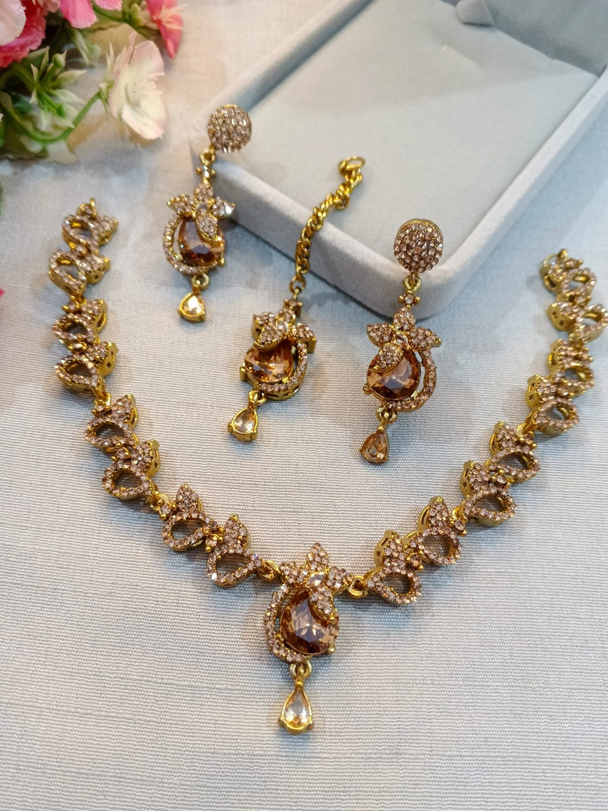 Brown polish zircon necklace set with earrings and tikka, champagne stones