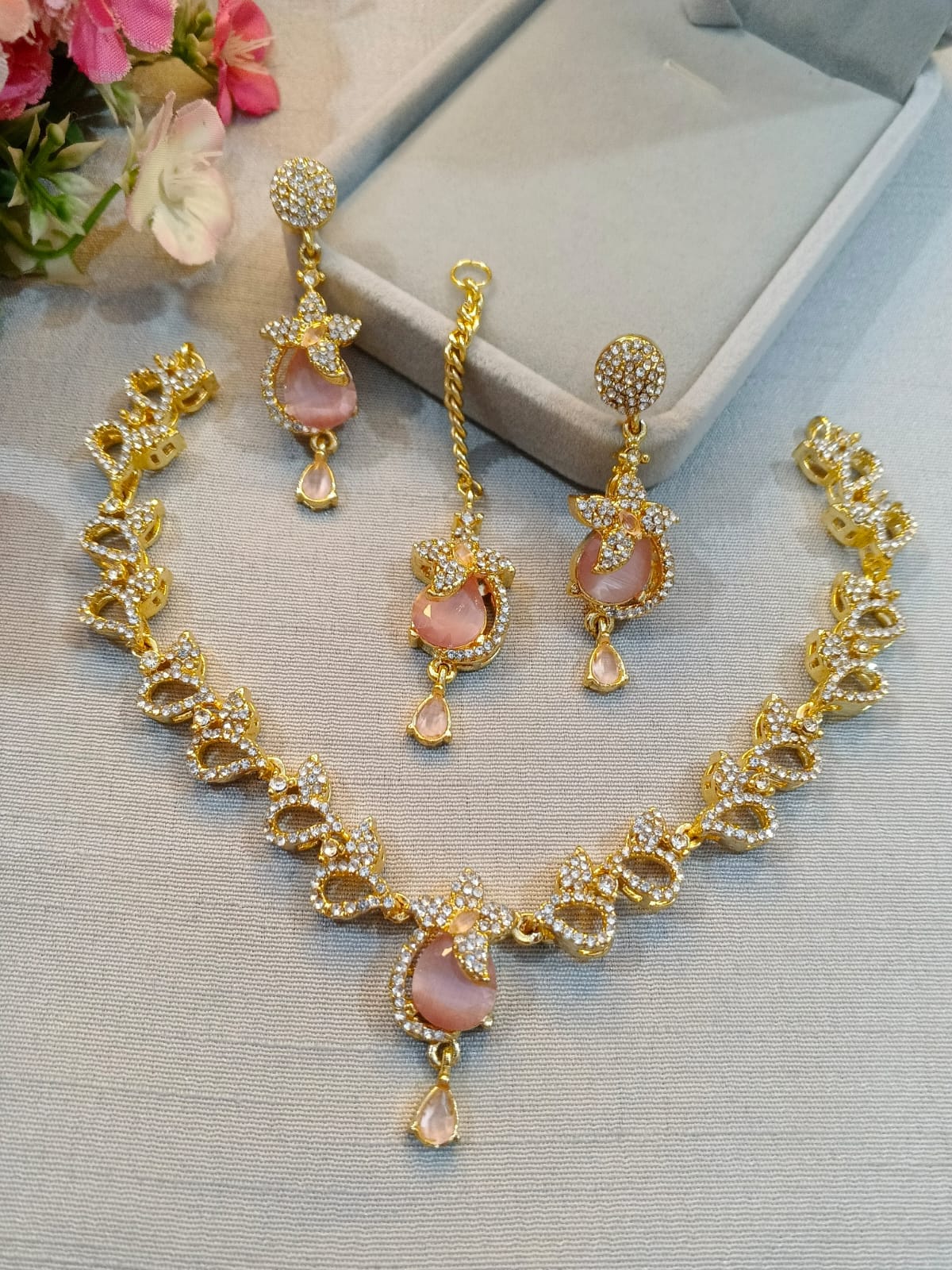 Gold polish zircon necklace set with earrings and tikka, blush pink stones