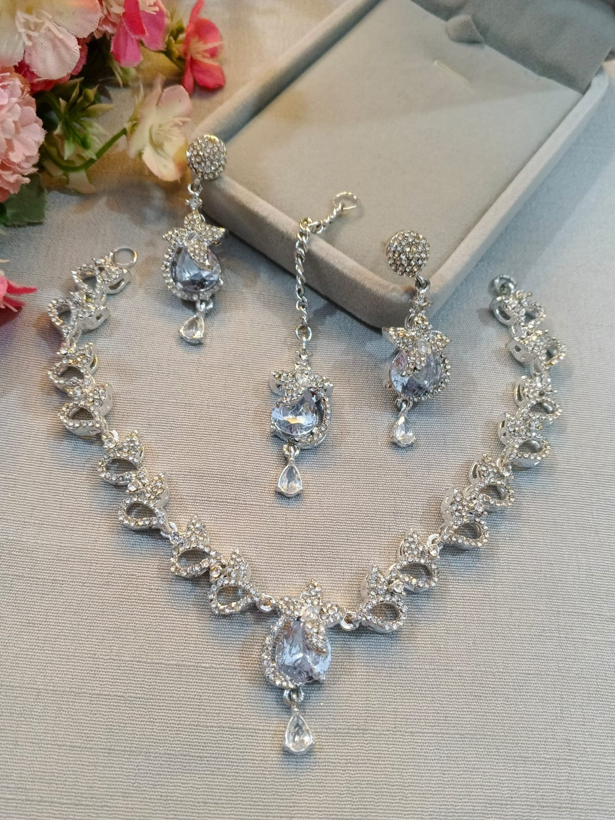 Silver zircon necklace set with earrings and tikka, crystal white stones