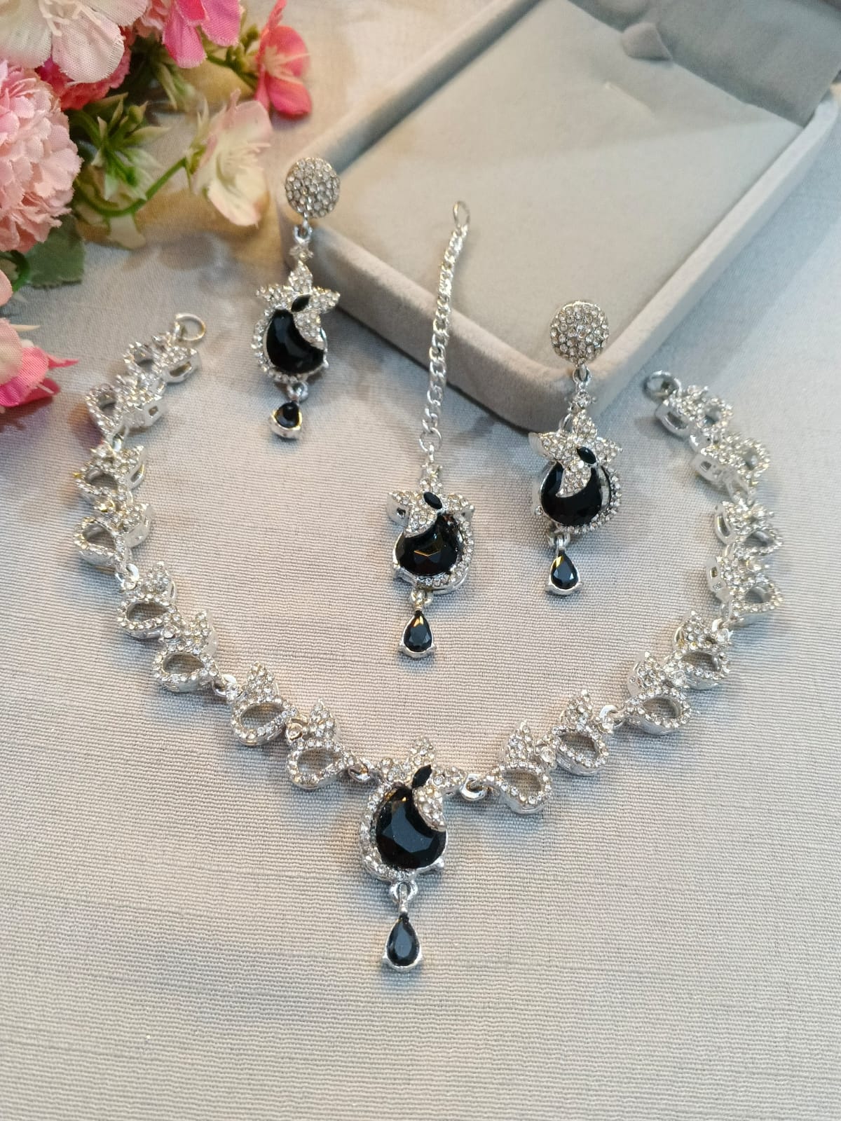 Silver zircon necklace set with earrings and tikka, jet black stones